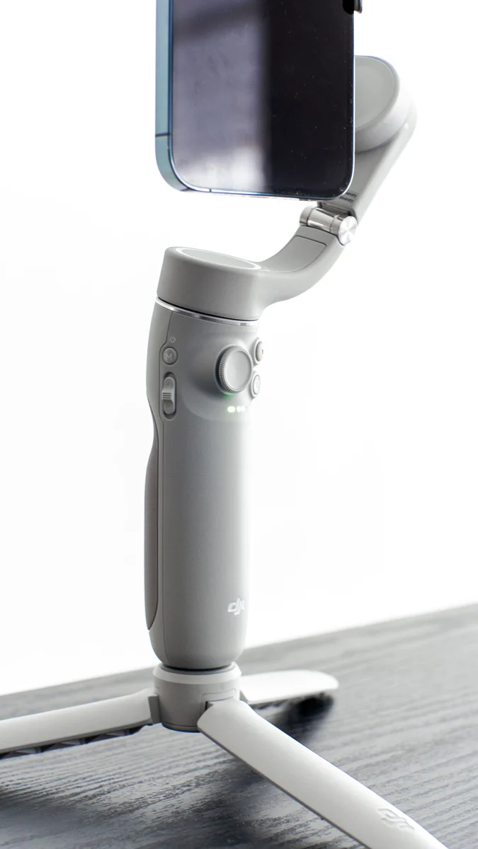 Phone holder on a compact tripod base