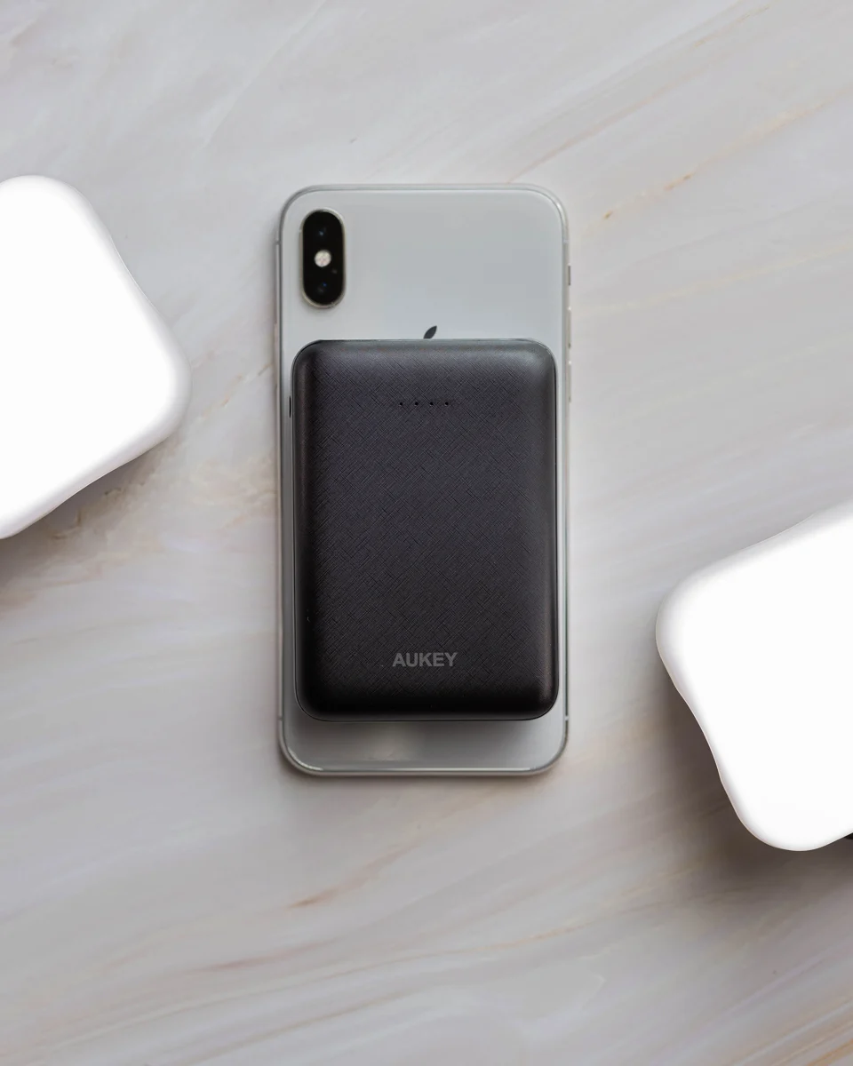 Compact power bank attached to a smartphone